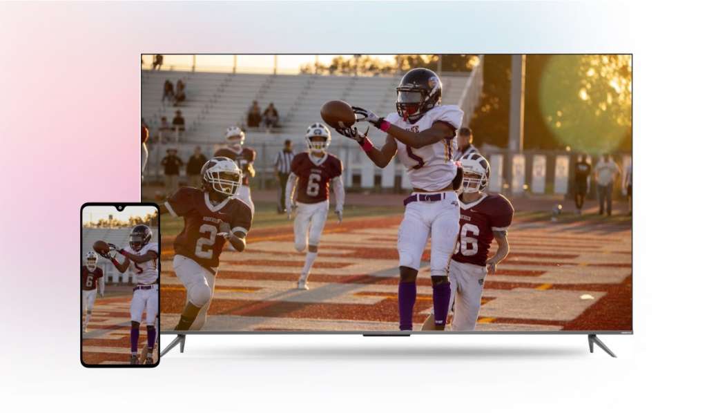 An iPhone mirroring an image of an American football match to a Hitachi TV