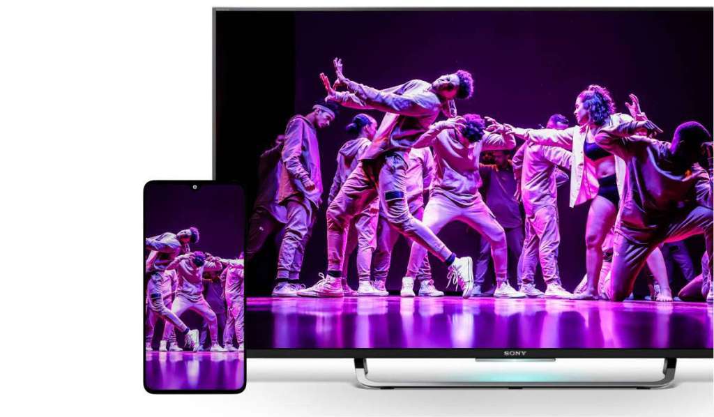 An iPhone casting an image of a dance performance to a Sony TV